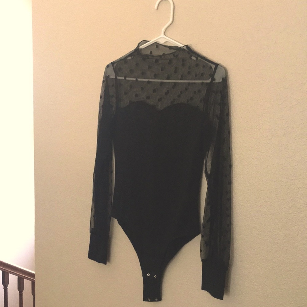 Lace polka dot bodysuit. Mesh arms and body con suit. Never worn. Like new.
